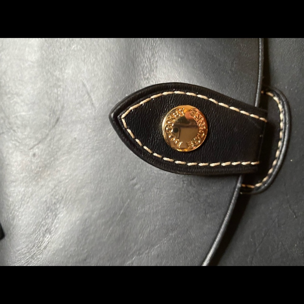 Brand new Dooney and Bourke black leather saddle bag 100% authentic